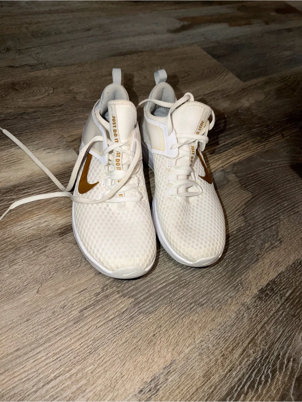 Nike Women's White Athletic Sneakers with Gold Swoosh